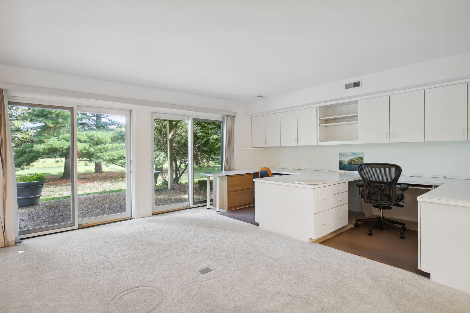 27 Fields East, Unit 27 Champaign, IL 61822 - Photo 26 of 35 a kitchen with a stove a refrigerator and white cabinets