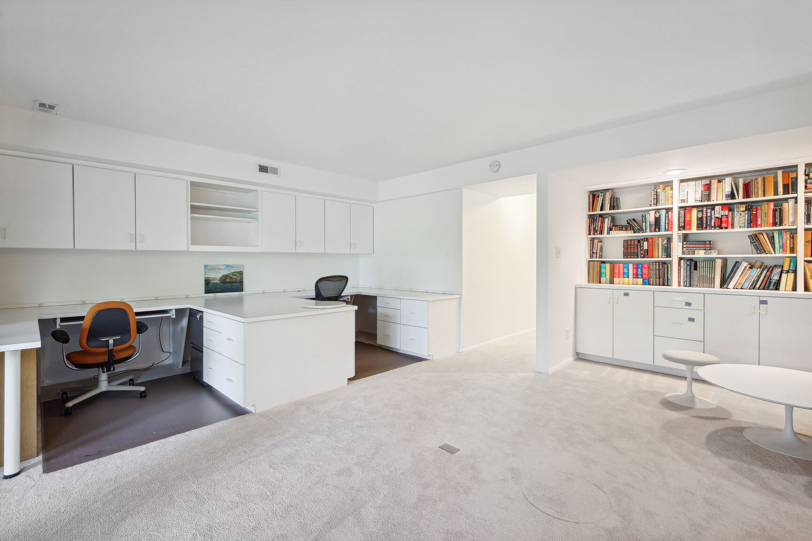 27 Fields East, Unit 27 Champaign, IL 61822 - Photo 27 of 35 a living room with furniture and white cabinets