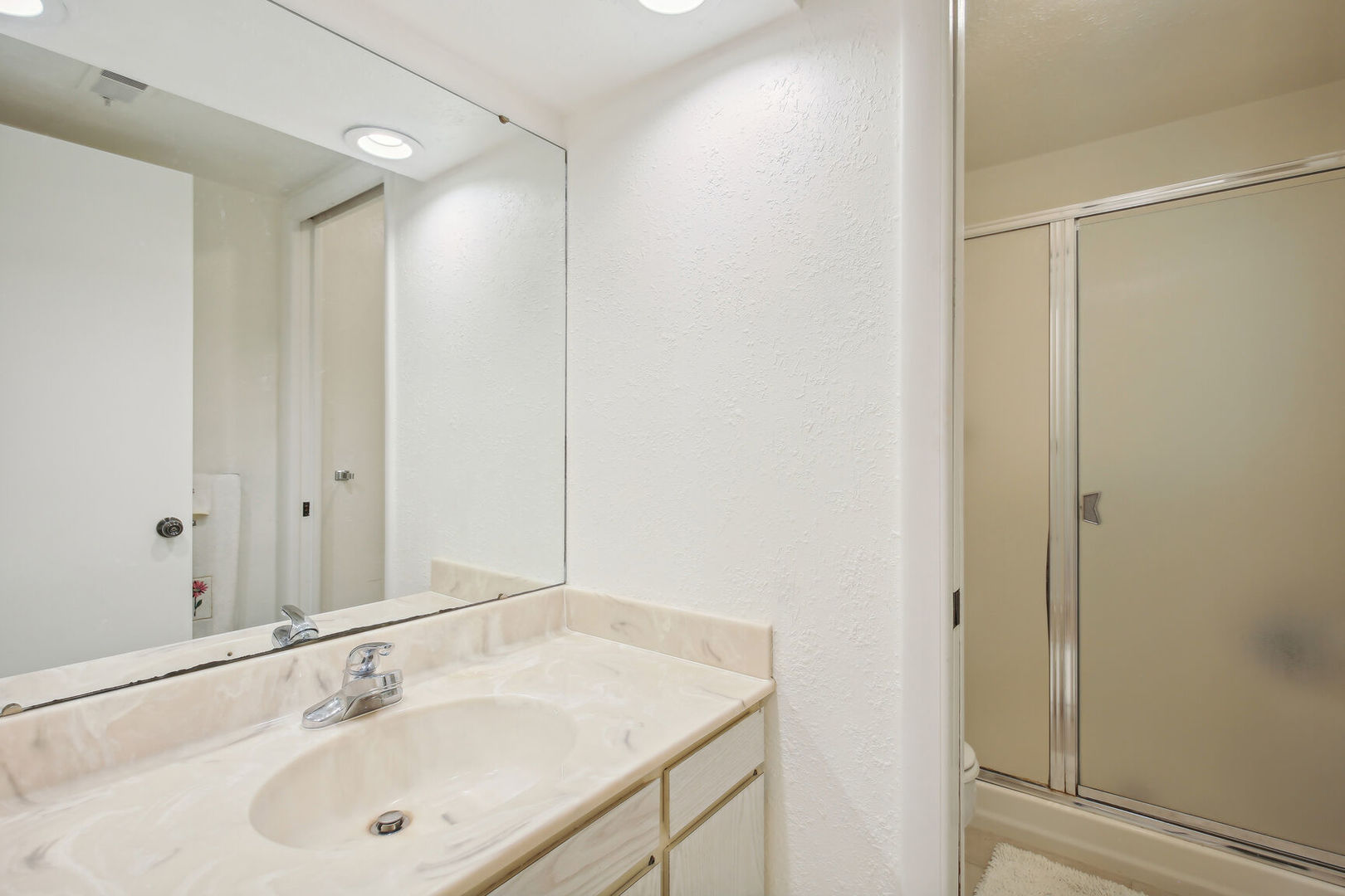 27 Fields East, Unit 27 Champaign, IL 61822 - Photo 28 of 35 a bathroom with a sink and a mirror