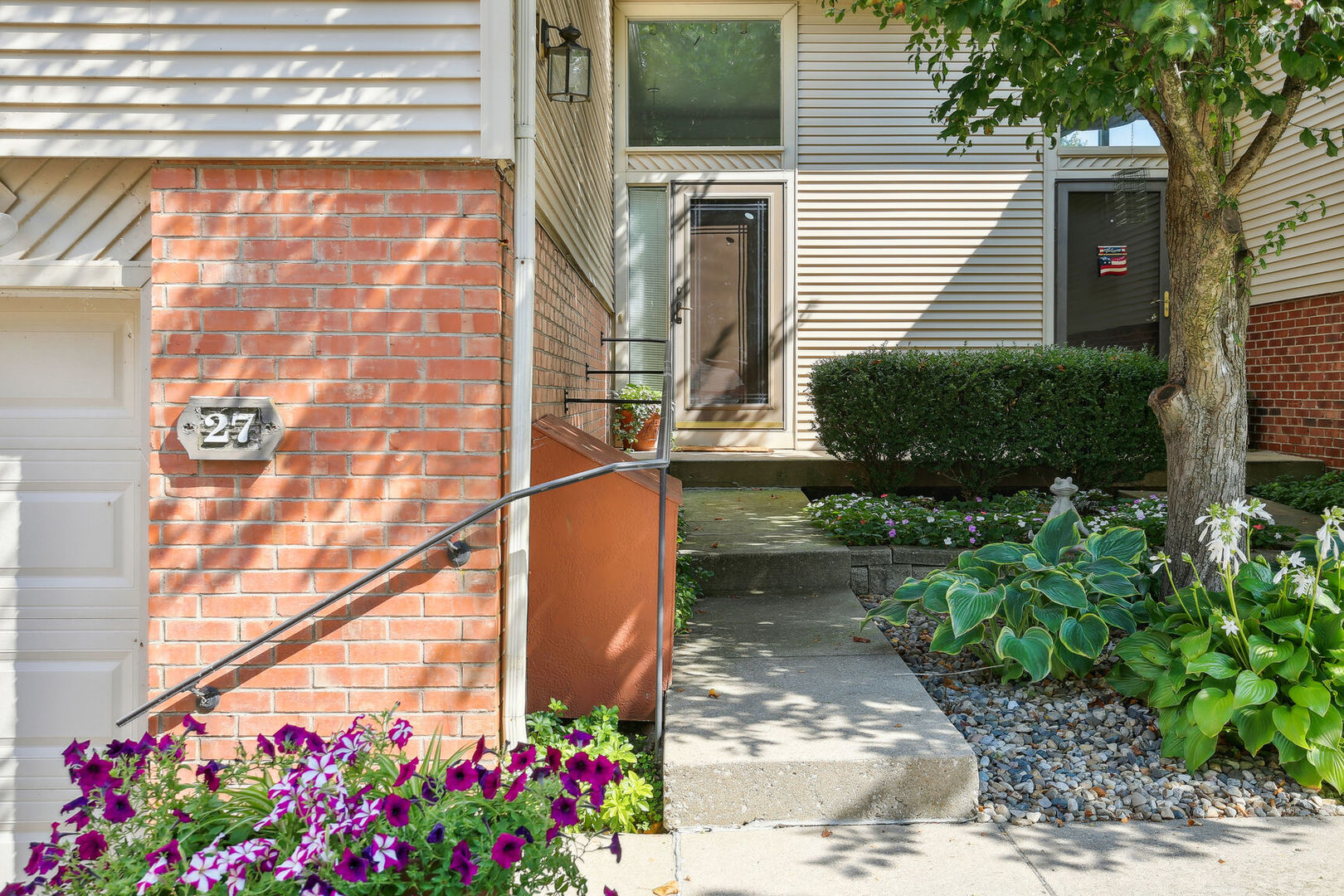 27 Fields East, Unit 27 Champaign, IL 61822 - Photo 3 of 35 a view of a potted plants next to a road