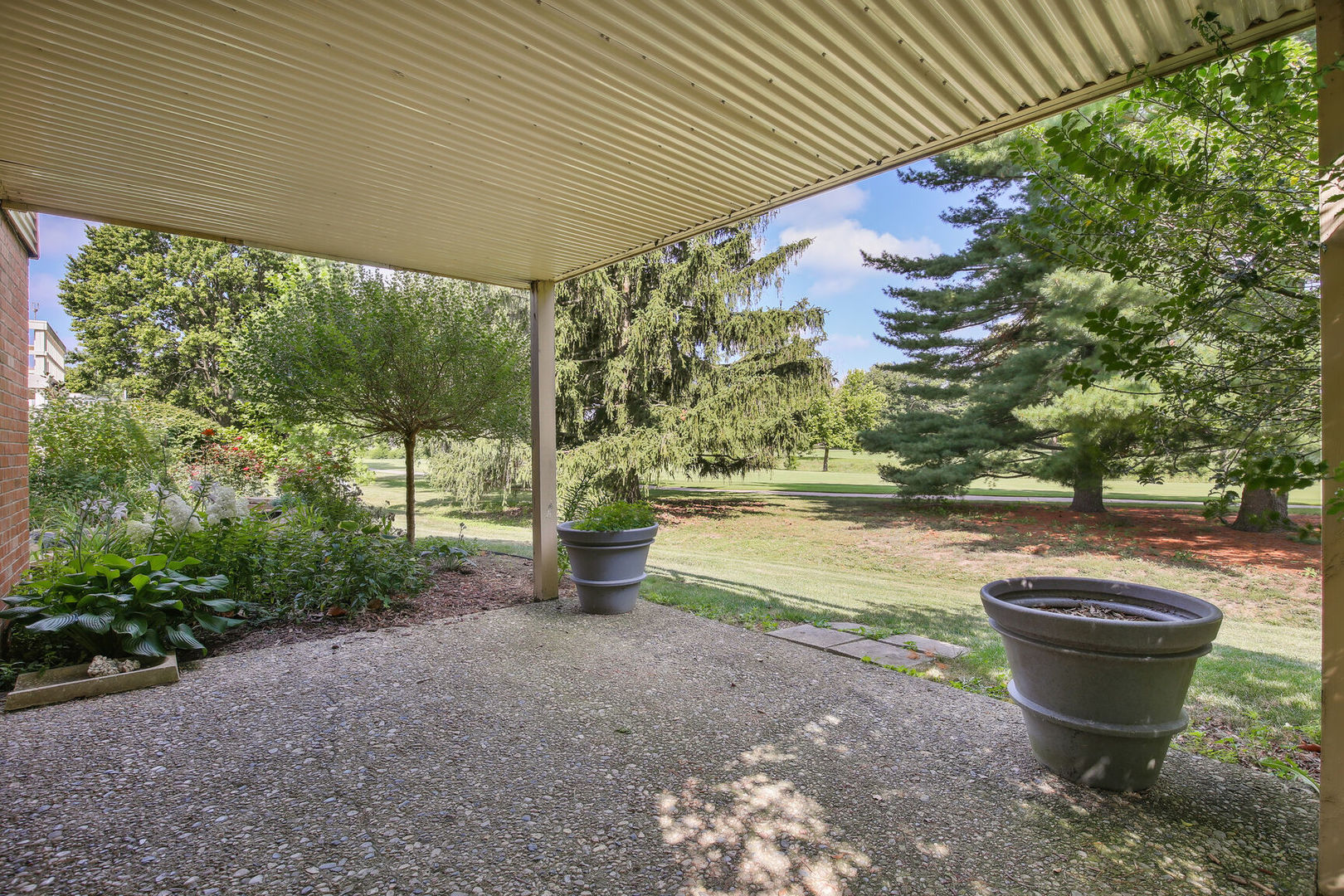 27 Fields East, Unit 27 Champaign, IL 61822 - Photo 33 of 35 a view of a swimming pool with a yard and plants