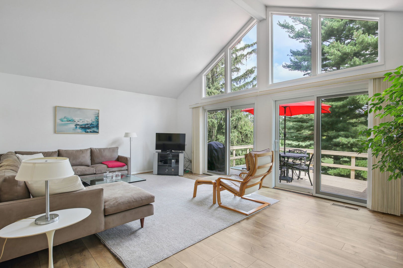 27 Fields East, Unit 27 Champaign, IL 61822 - Photo 6 of 35 a living room with furniture and a large window