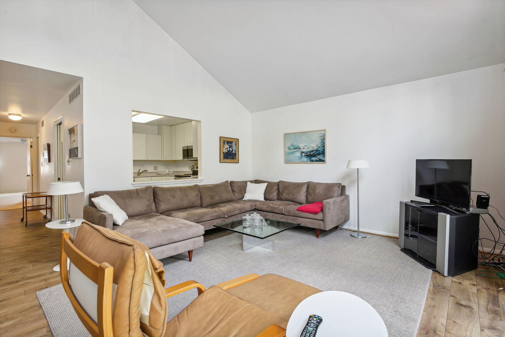 27 Fields East, Unit 27 Champaign, IL 61822 - Photo 7 of 35 a living room with furniture and a flat screen tv