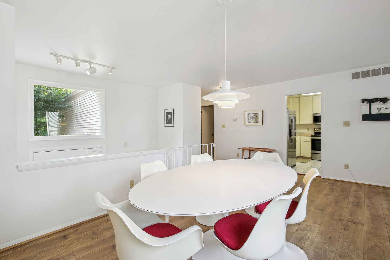27 Fields East, Unit 27 Champaign, IL 61822 - Photo 10 of 35 a view of a dining room with furniture and wooden floor