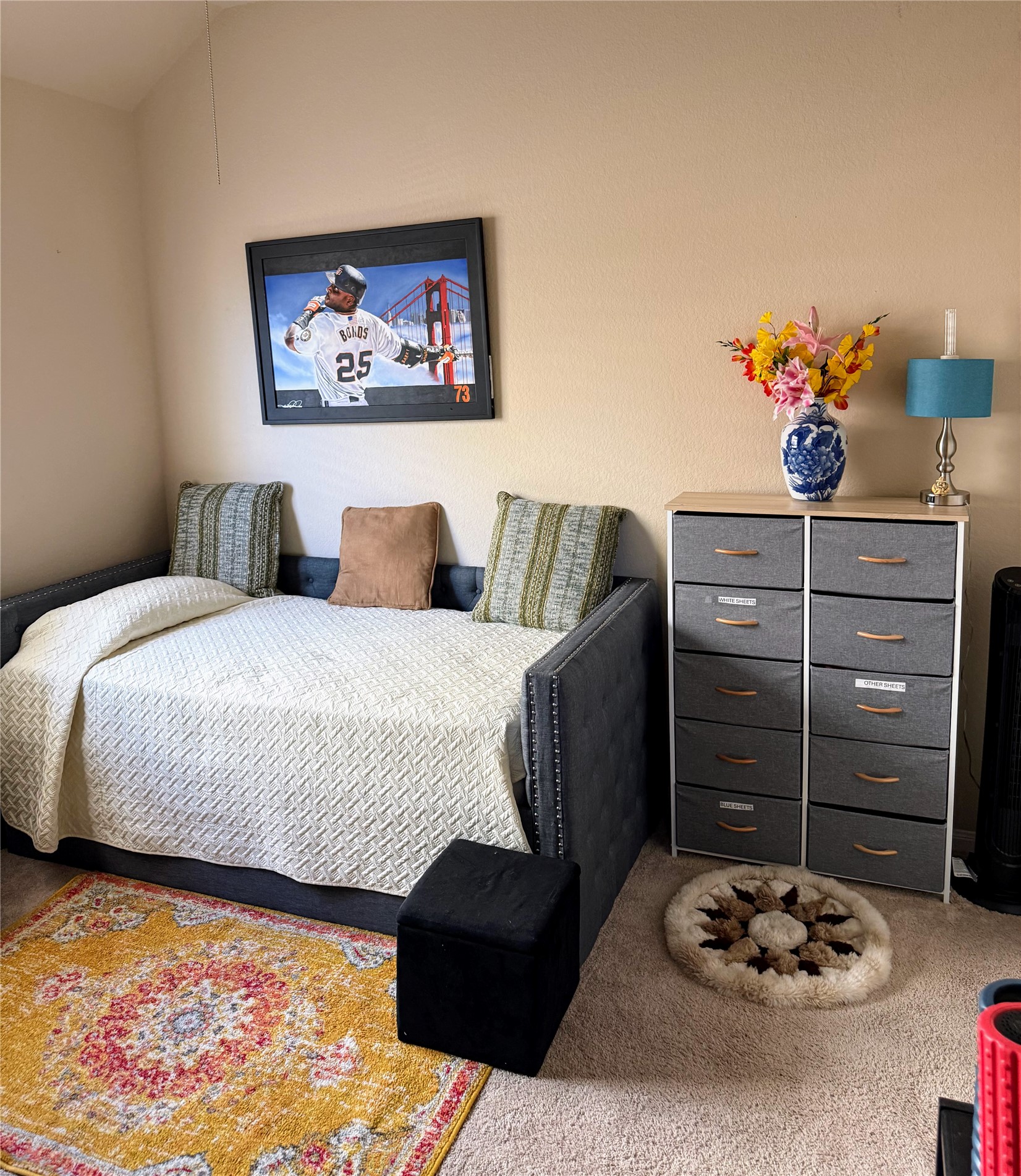 24015 Corinaldo Court Katy, TX 77493 - Photo 12 of 16 a bedroom with a bed and a wall painting