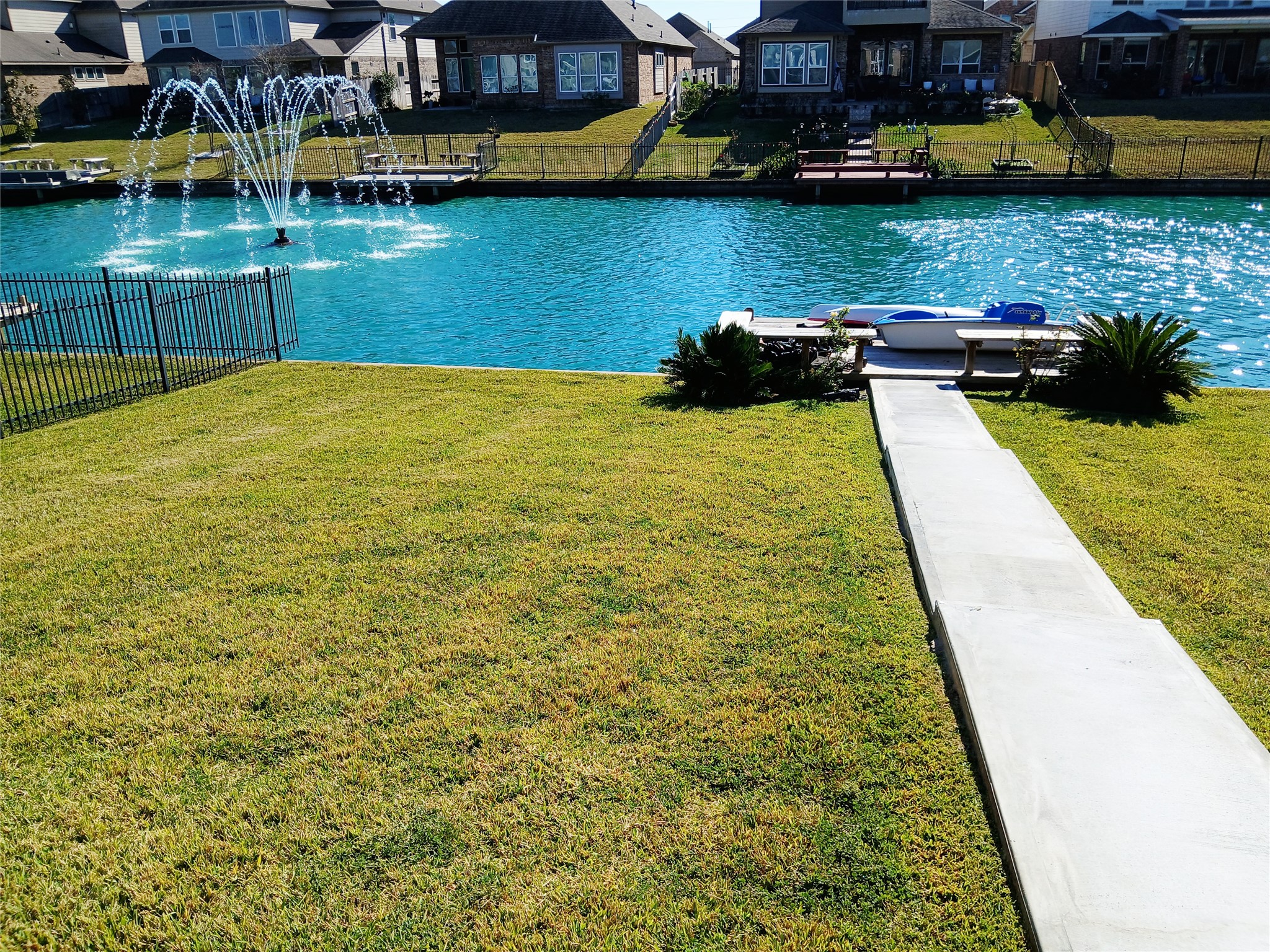 24015 Corinaldo Court Katy, TX 77493 - Photo 13 of 16 a view of a lake with houses