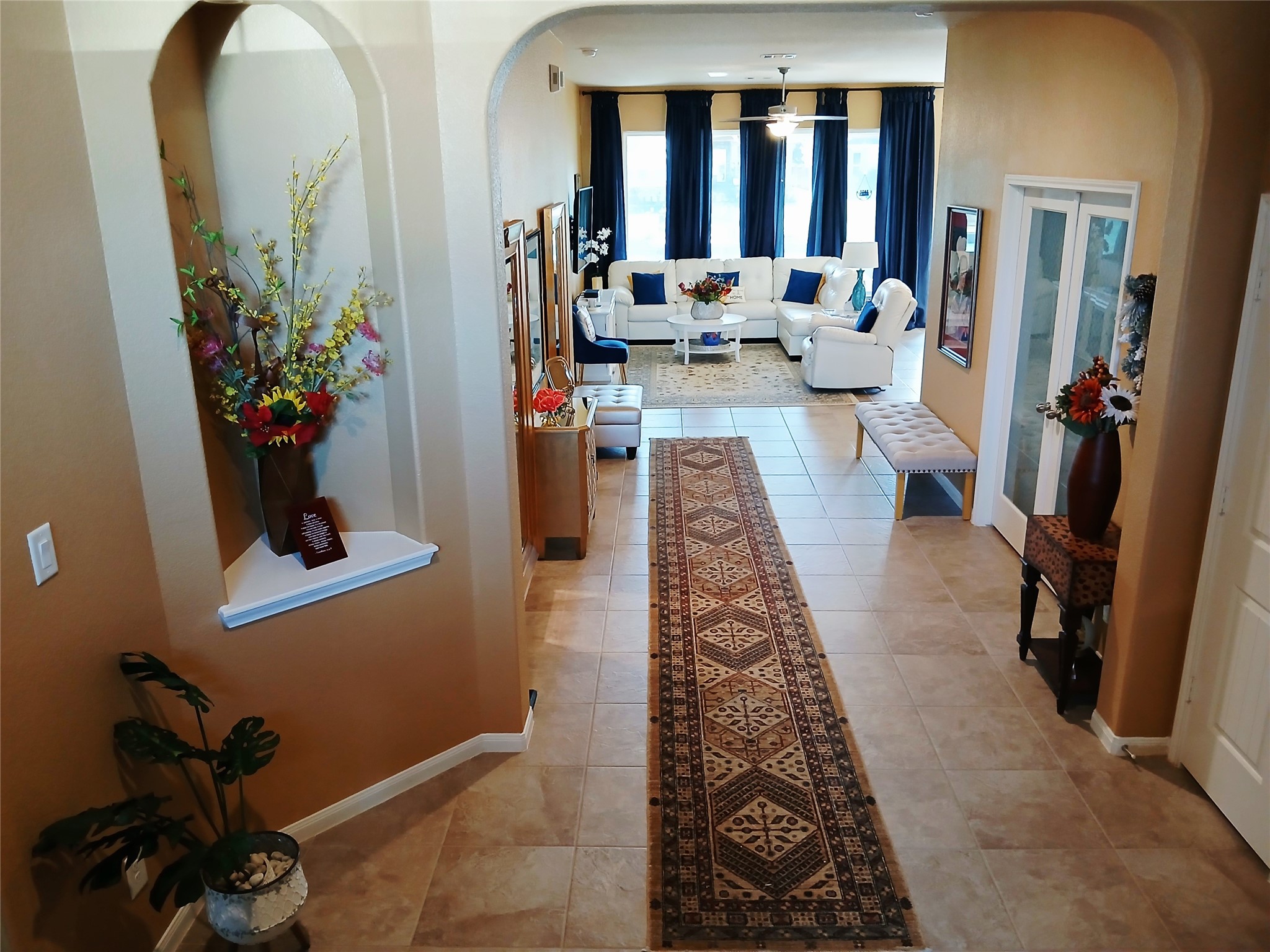 24015 Corinaldo Court Katy, TX 77493 - Photo 3 of 16 a living room with furniture and a potted plant