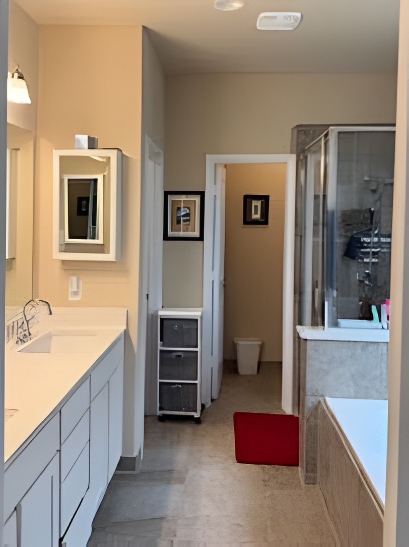 24015 Corinaldo Court Katy, TX 77493 - Photo 9 of 16 a spacious bathroom with a tub sink and mirror