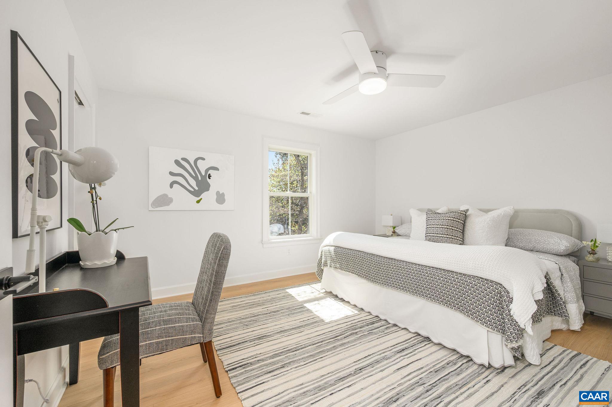 103 Chaucer Road Charlottesville, VA 22901 - Photo 15 of 34 a bedroom with a bed and a table