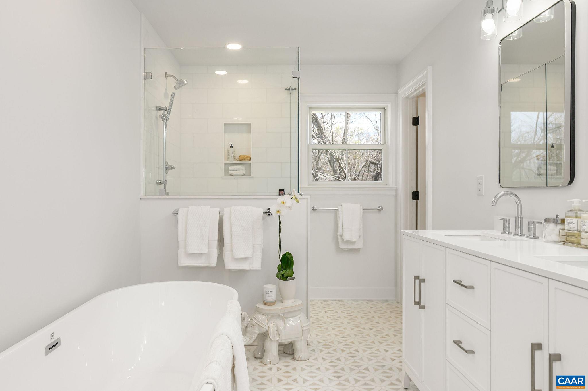 103 Chaucer Road Charlottesville, VA 22901 - Photo 17 of 34 a bathroom with a tub sink and mirror