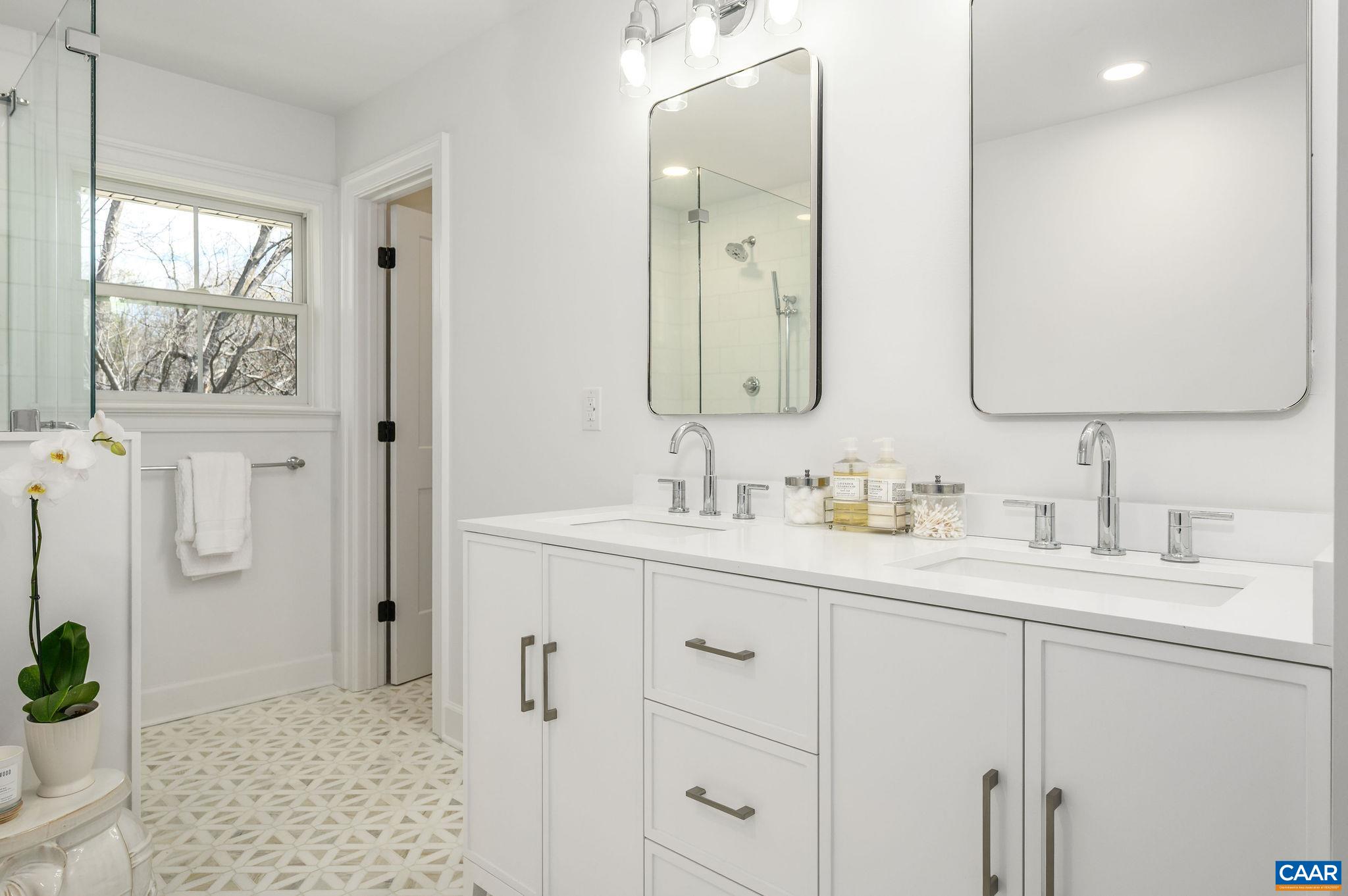 103 Chaucer Road Charlottesville, VA 22901 - Photo 18 of 34 a bathroom with a sink and a mirror