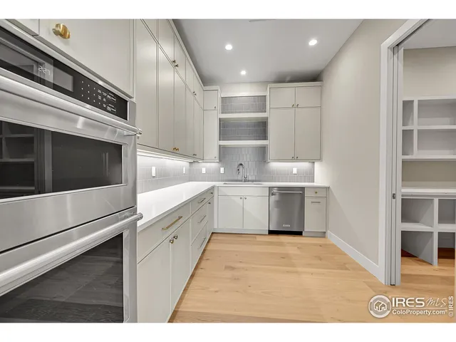 a utility room with sink dryer and washer