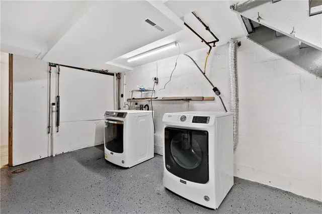 a utility room with dryer and washer