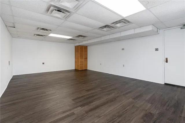 an empty room with wooden floor