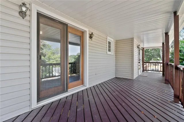 a view of outdoor space with wooden floor