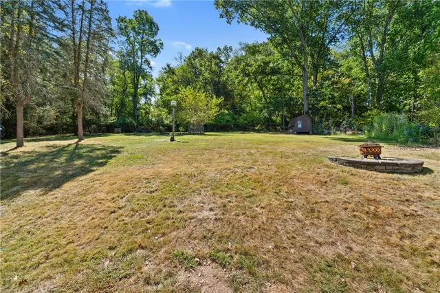 a backyard of a house with lots of green space