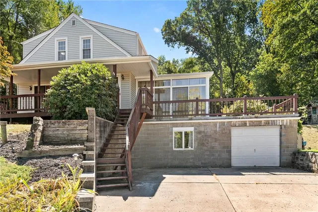 a front view of a house with fountain