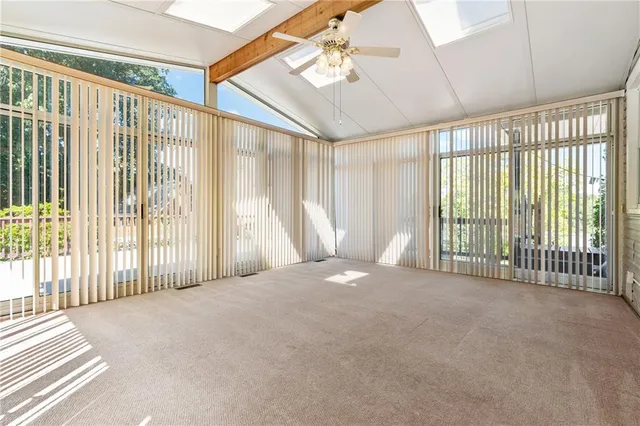 a view of an empty room with a sliding door