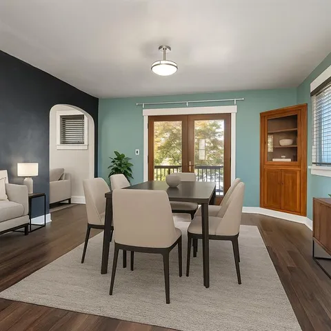 a view of a dining room with furniture window and wooden floor