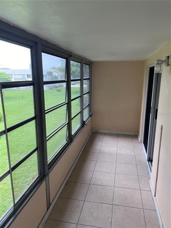 240 Northampton L, Unit 240 West Palm Beach, FL 33417 - Photo 10 of 11 a view of empty room with window