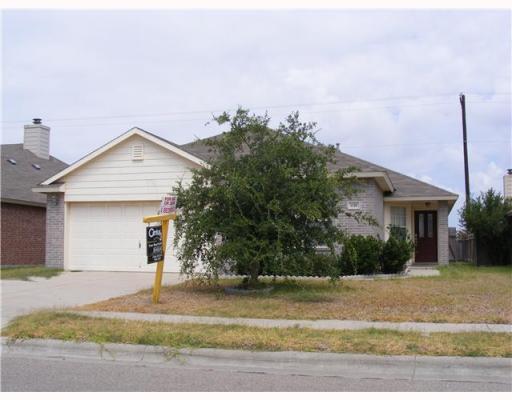 1118 Cupertino Street Portland, TX 78374 - Photo 1 of 1 a front view of a house with a yard and garage