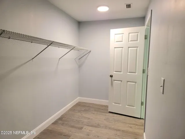 a bathroom with a double vanity sink mirror and toilet