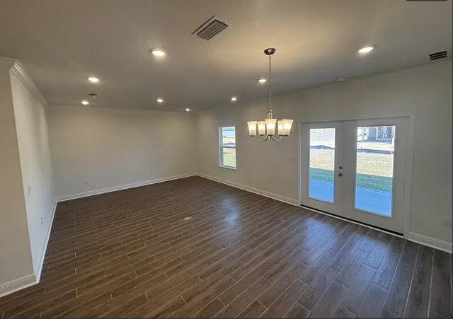 a view of kitchen and sink with wooden floor