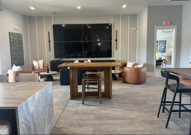 a living room with fireplace furniture and a flat screen tv