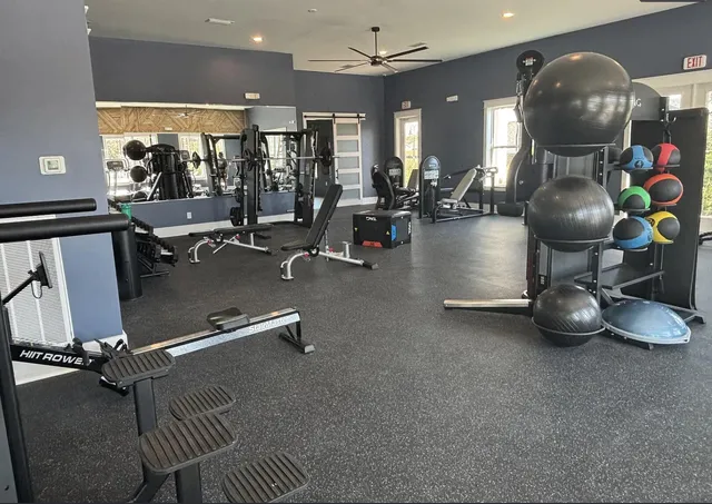 a view of a dining room with furniture large windows and wooden floor