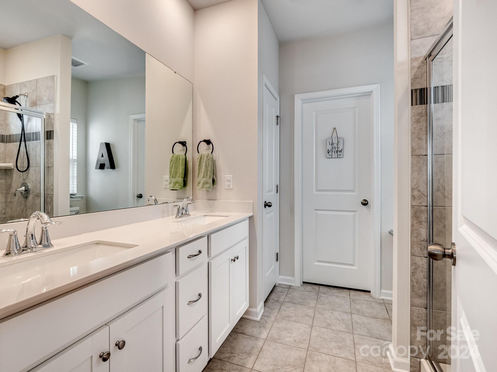 6515 Gopher Road Lancaster, SC 29720 - Photo 19 of 35 a bathroom with a granite countertop sink and a mirror