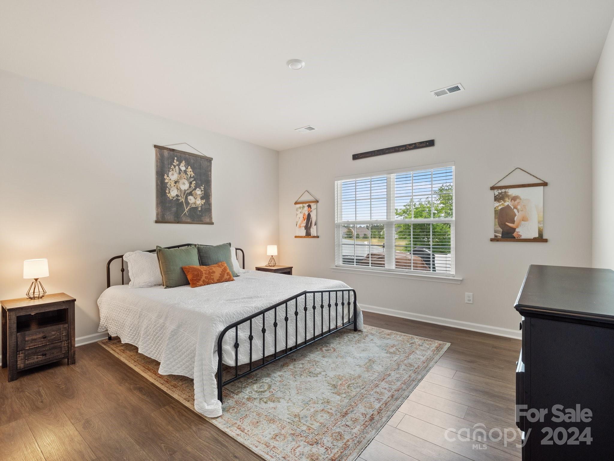 6515 Gopher Road Lancaster, SC 29720 - Photo 2 of 35 a bedroom with a bed a couch and a window