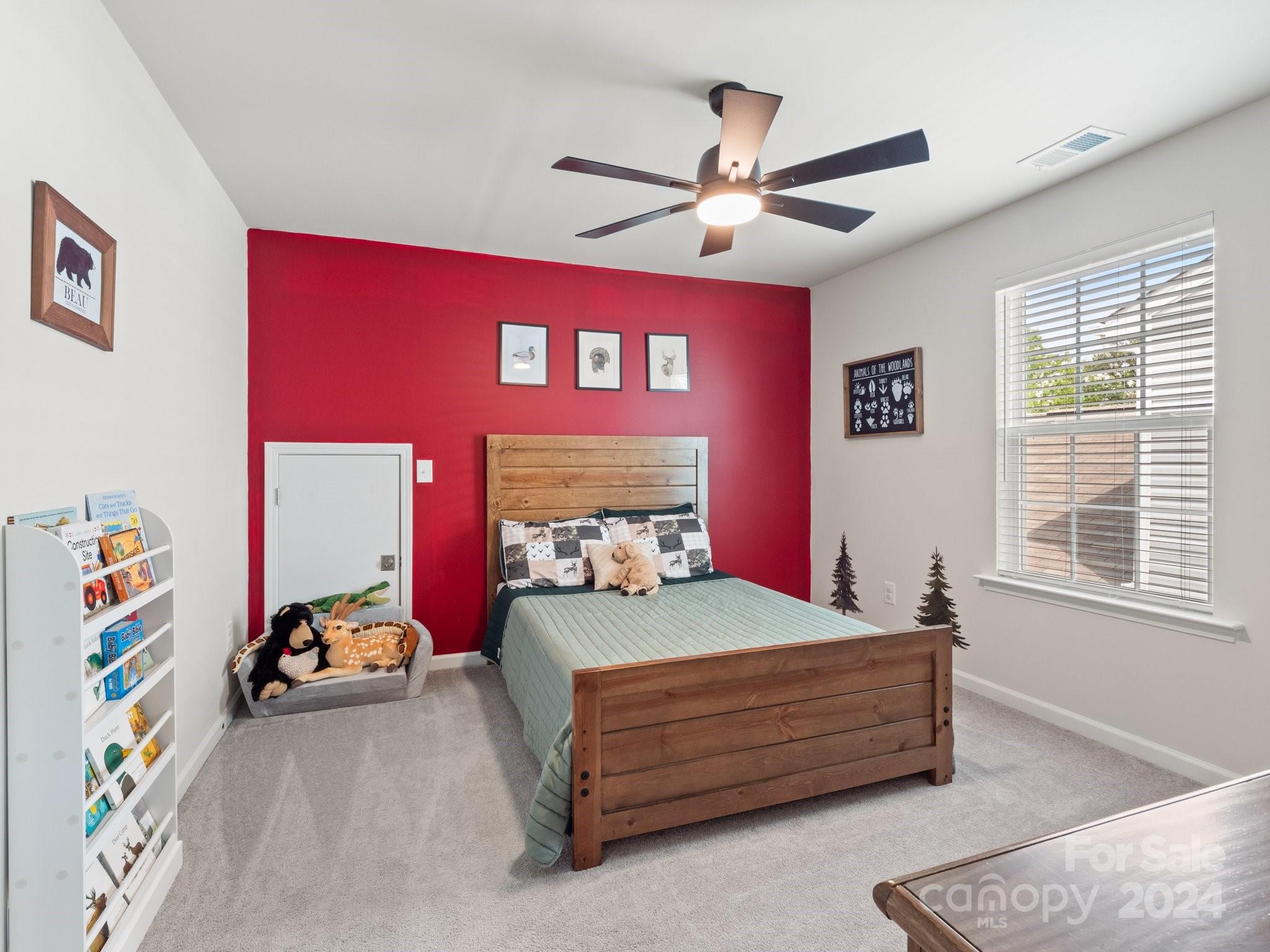 6515 Gopher Road Lancaster, SC 29720 - Photo 24 of 35 a bedroom with a bed and a chandelier