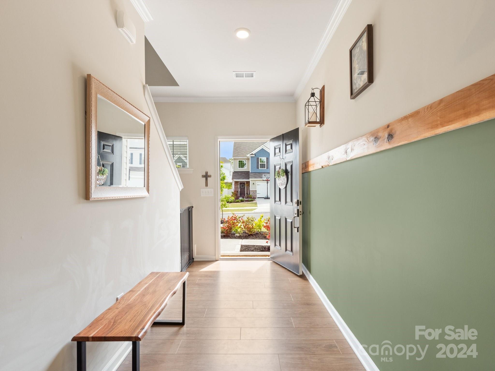 6515 Gopher Road Lancaster, SC 29720 - Photo 5 of 35 a hallway with a wooden floor and a bathroom