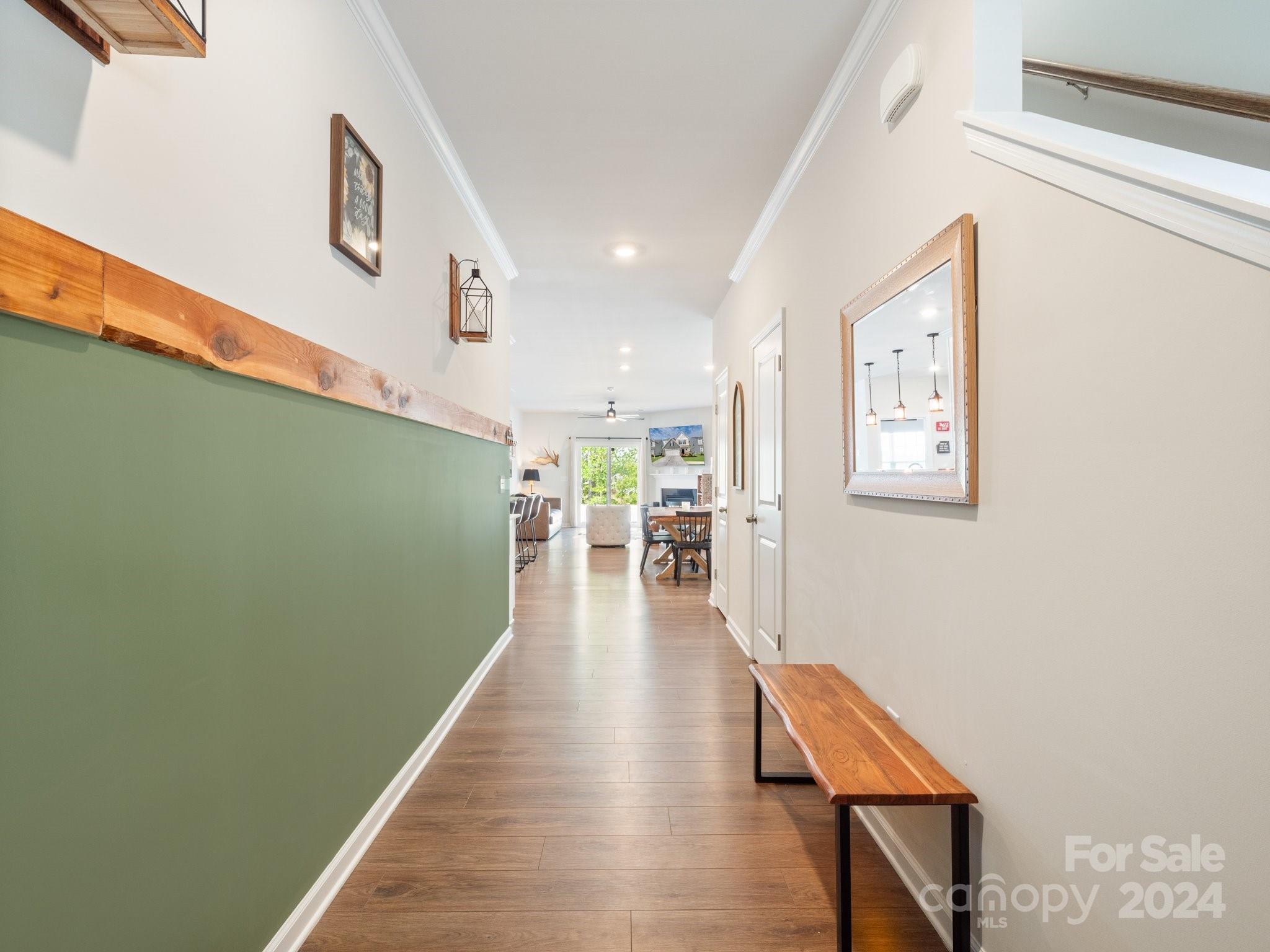 6515 Gopher Road Lancaster, SC 29720 - Photo 6 of 35 a hallway with wooden floor table and chairs