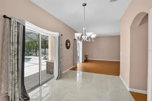 a kitchen with stainless steel appliances granite countertop a sink stove microwave and refrigerator