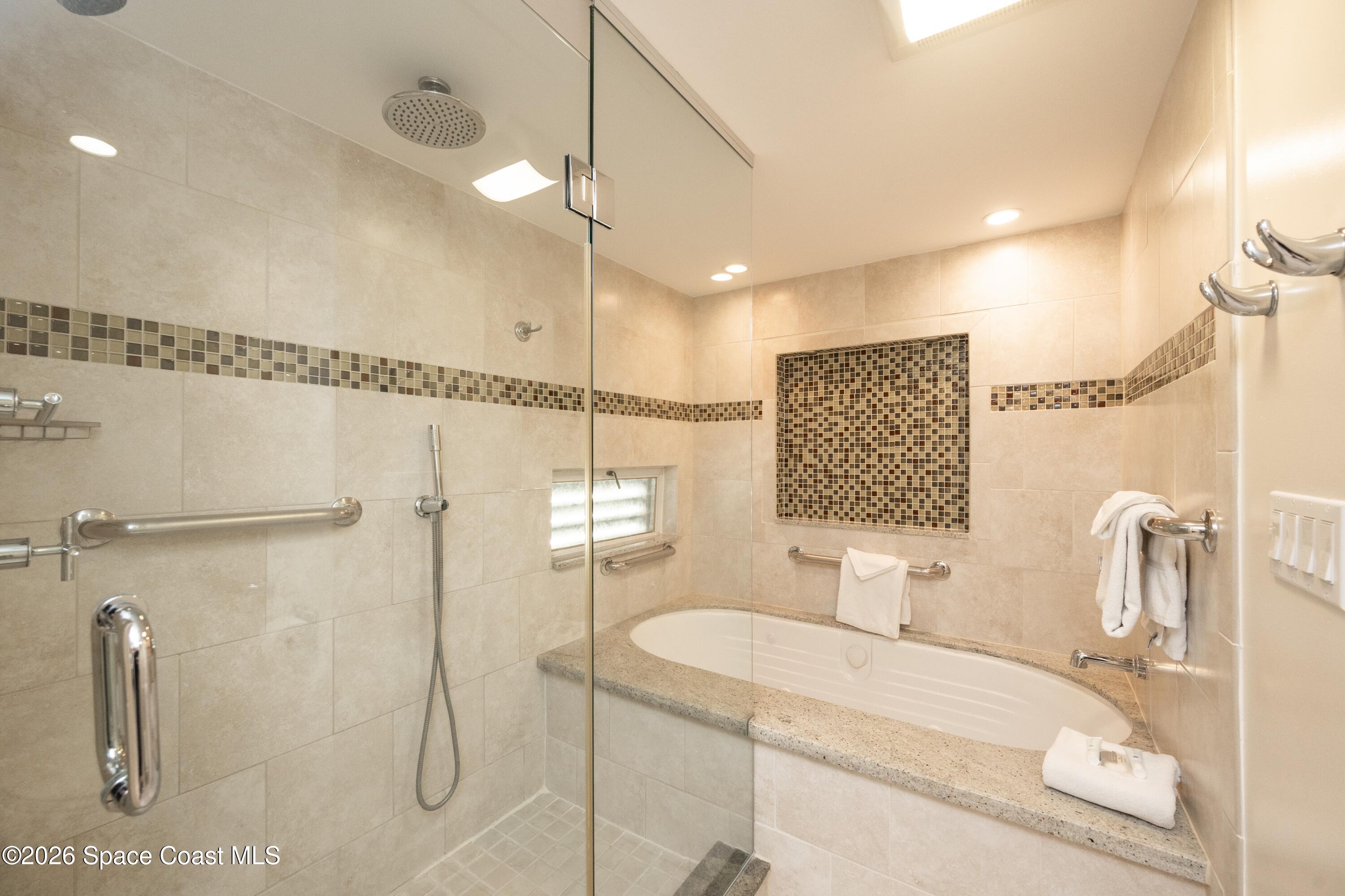 617 Front Street, Unit A52 Key West, FL 33040 - Photo 17 of 42 a bathroom with a sink and mirror