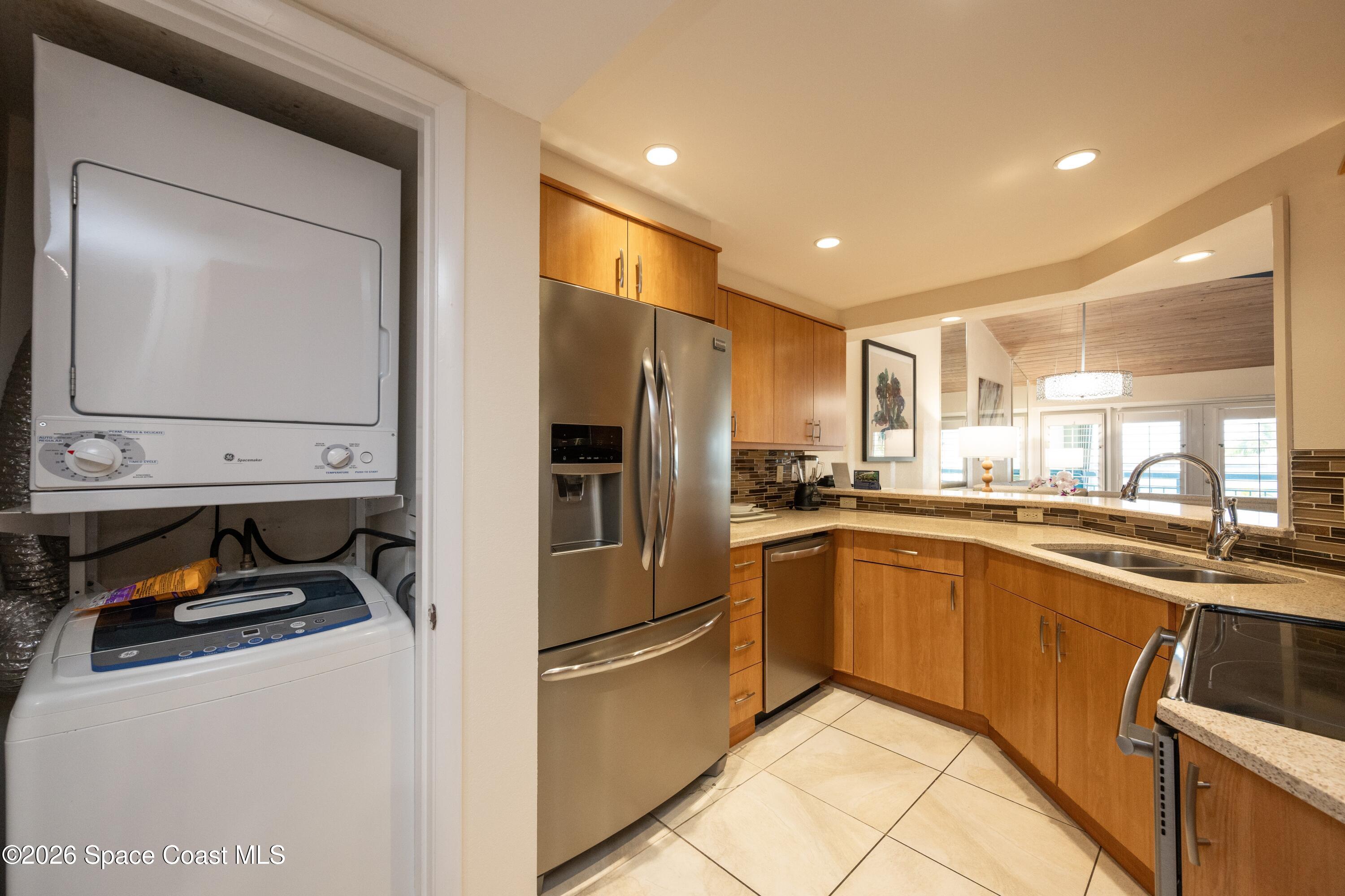 617 Front Street, Unit A52 Key West, FL 33040 - Photo 23 of 42 a kitchen with cabinets and stainless steel appliances