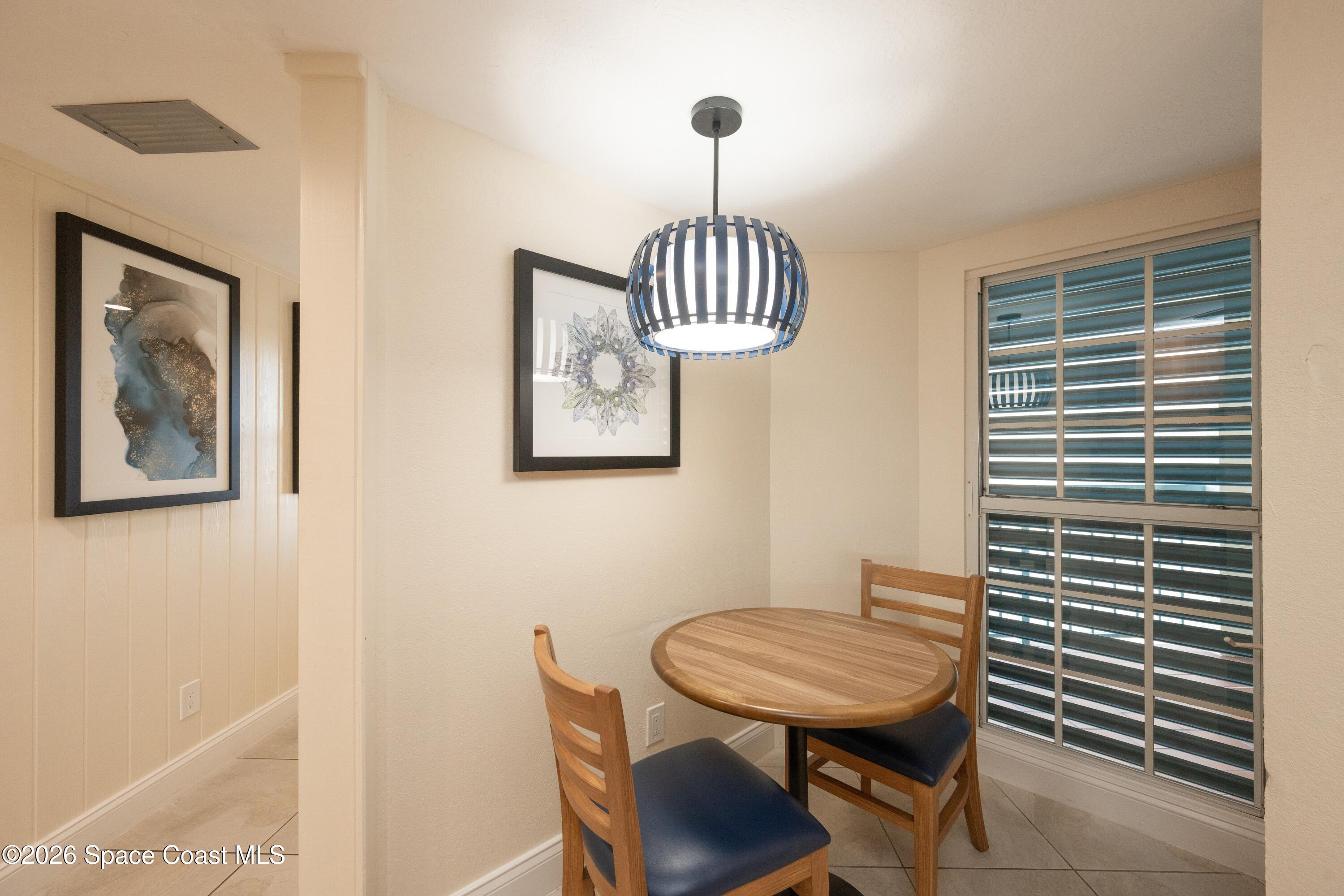 617 Front Street, Unit A52 Key West, FL 33040 - Photo 26 of 42 a view of a room that has a table and chair