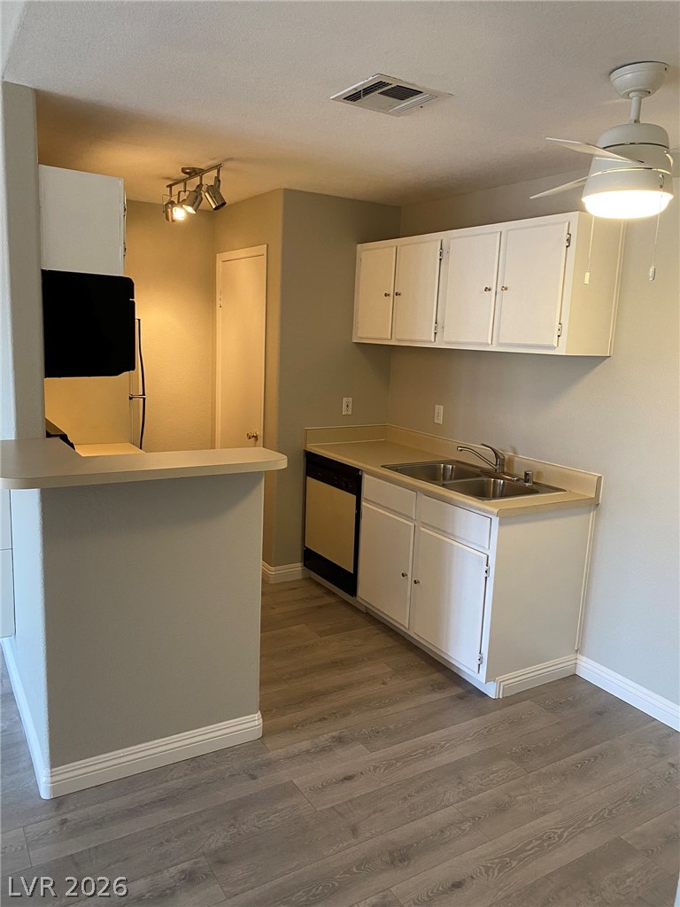 5271 South Lindell Road, Unit 202 Las Vegas, NV 89118 - Photo 13 of 27 Functional kitchen with ample cabinet storage and a convenient breakfast bar.
