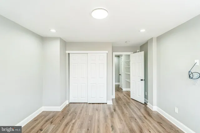 a view of hallway with wooden floor