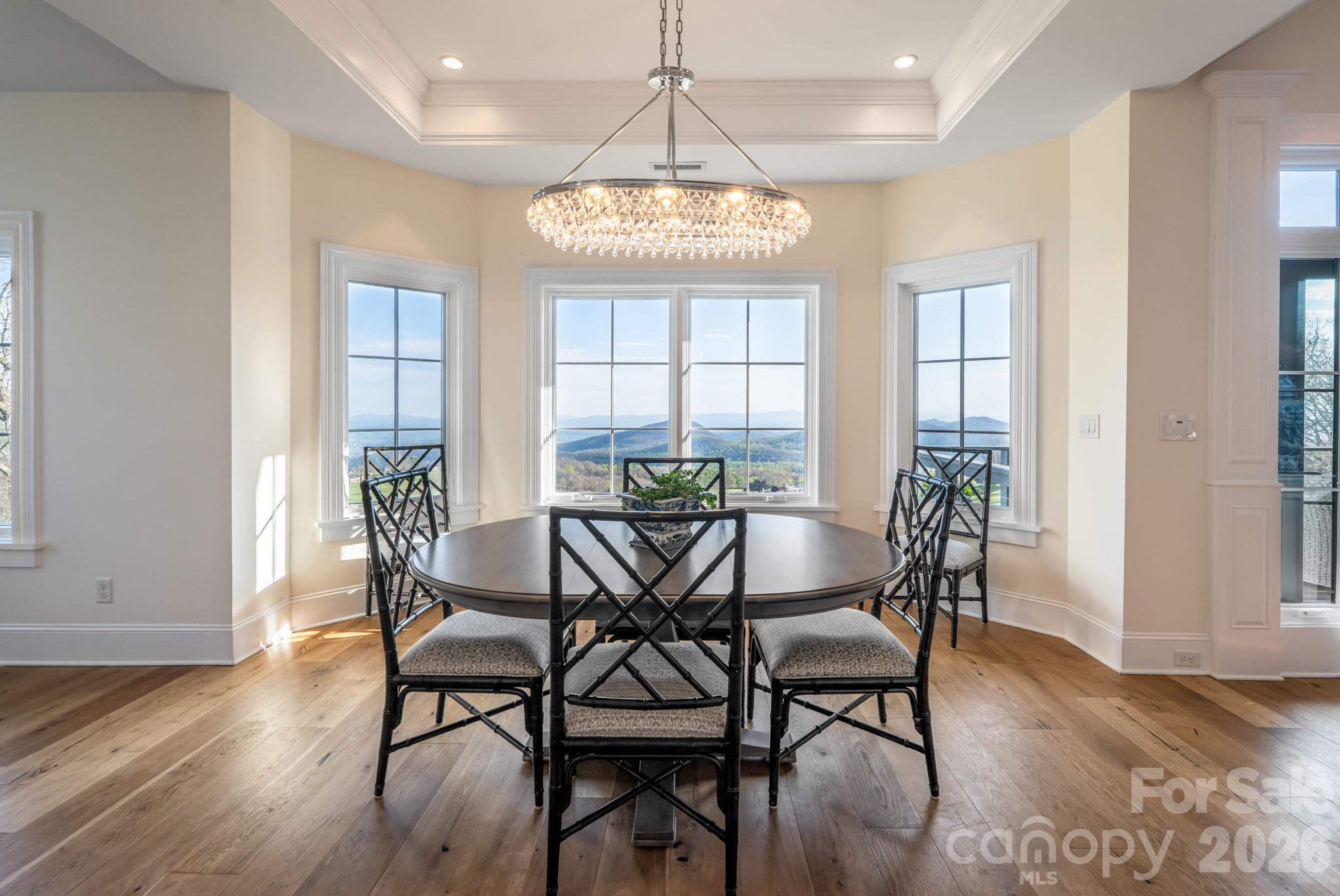 89 North Snow Ridge Drive, Unit 13 Hendersonville, NC 28792 - Photo 21 of 47 a view of a dining room with furniture window and wooden floor