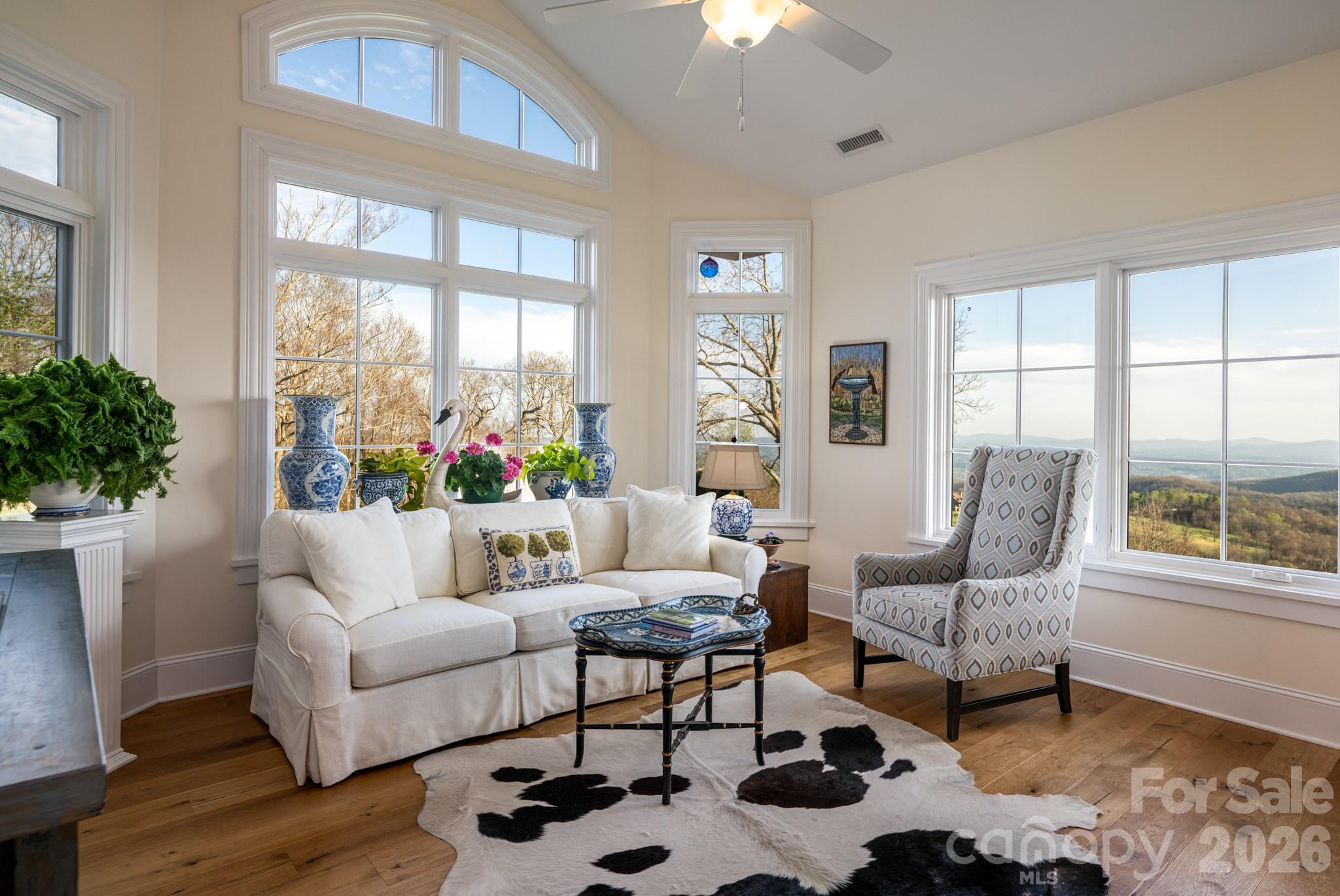 89 North Snow Ridge Drive, Unit 13 Hendersonville, NC 28792 - Photo 23 of 47 a living room with furniture and a large window