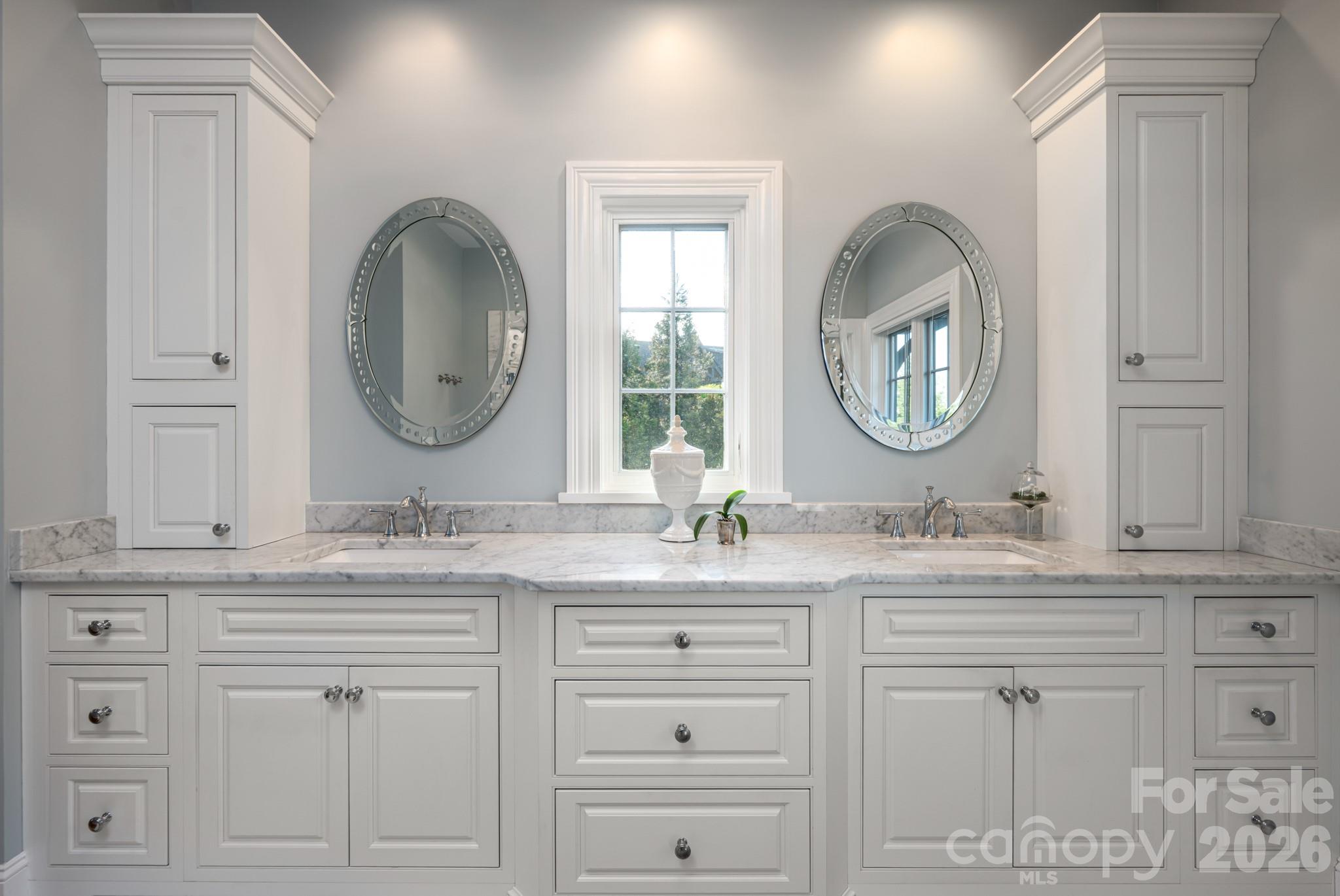 89 North Snow Ridge Drive, Unit 13 Hendersonville, NC 28792 - Photo 34 of 47 a bathroom with a double vanity sink and a mirror