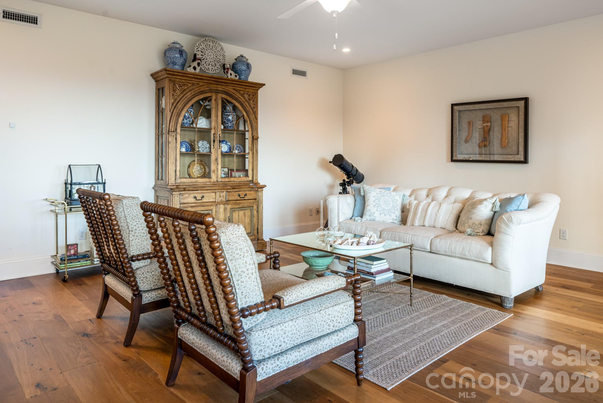 89 North Snow Ridge Drive, Unit 13 Hendersonville, NC 28792 - Photo 36 of 47 a living room with furniture and wooden floor