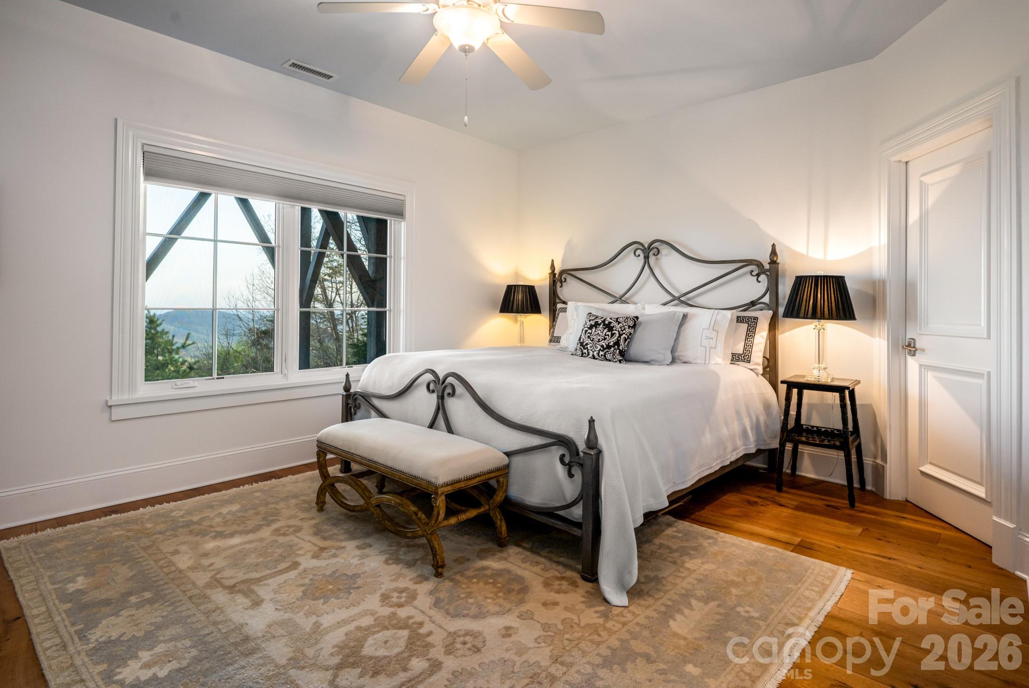 89 North Snow Ridge Drive, Unit 13 Hendersonville, NC 28792 - Photo 39 of 47 a bedroom with a bed chair and a window