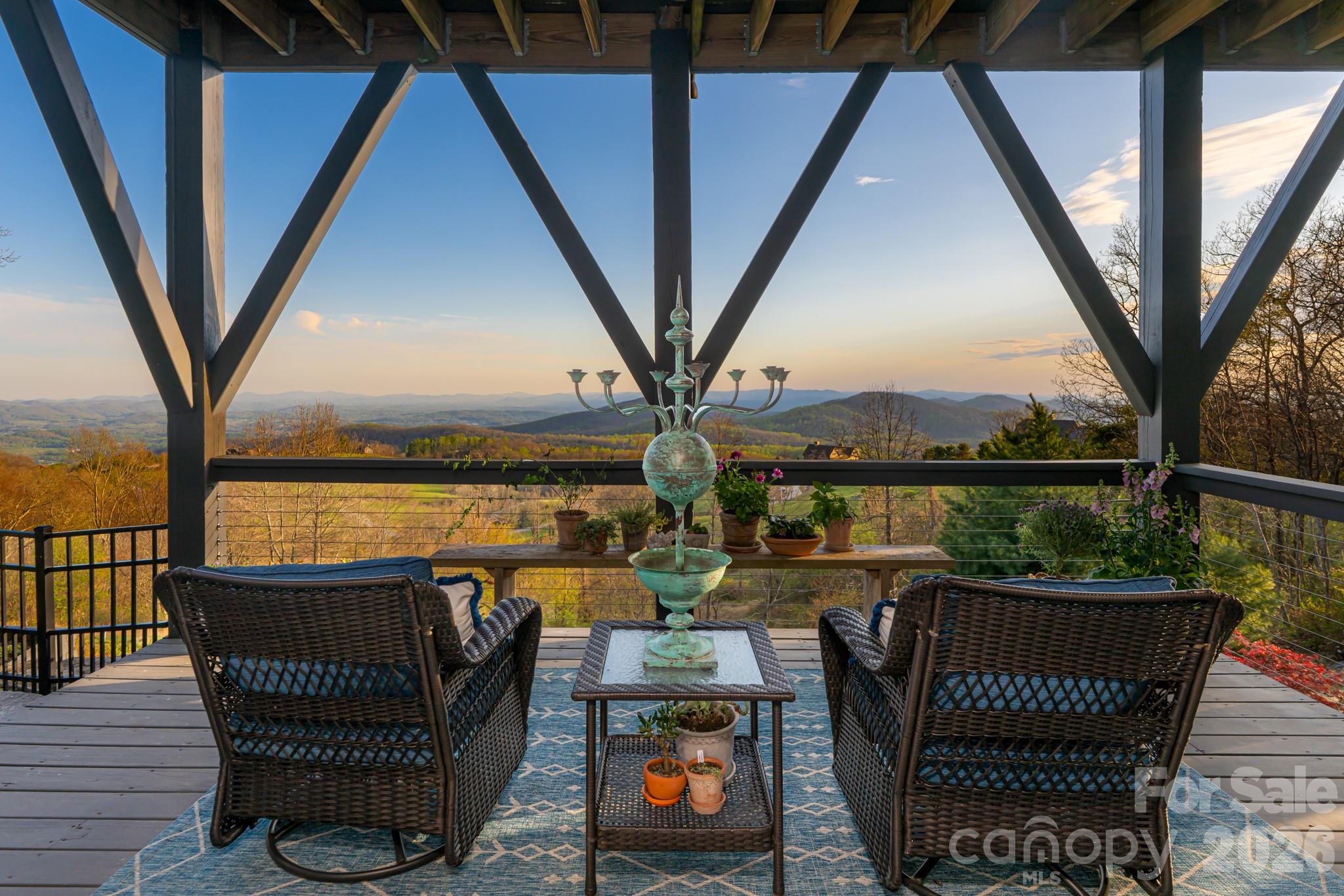 89 North Snow Ridge Drive, Unit 13 Hendersonville, NC 28792 - Photo 40 of 47 a view of a balcony with furniture and hardwood floor