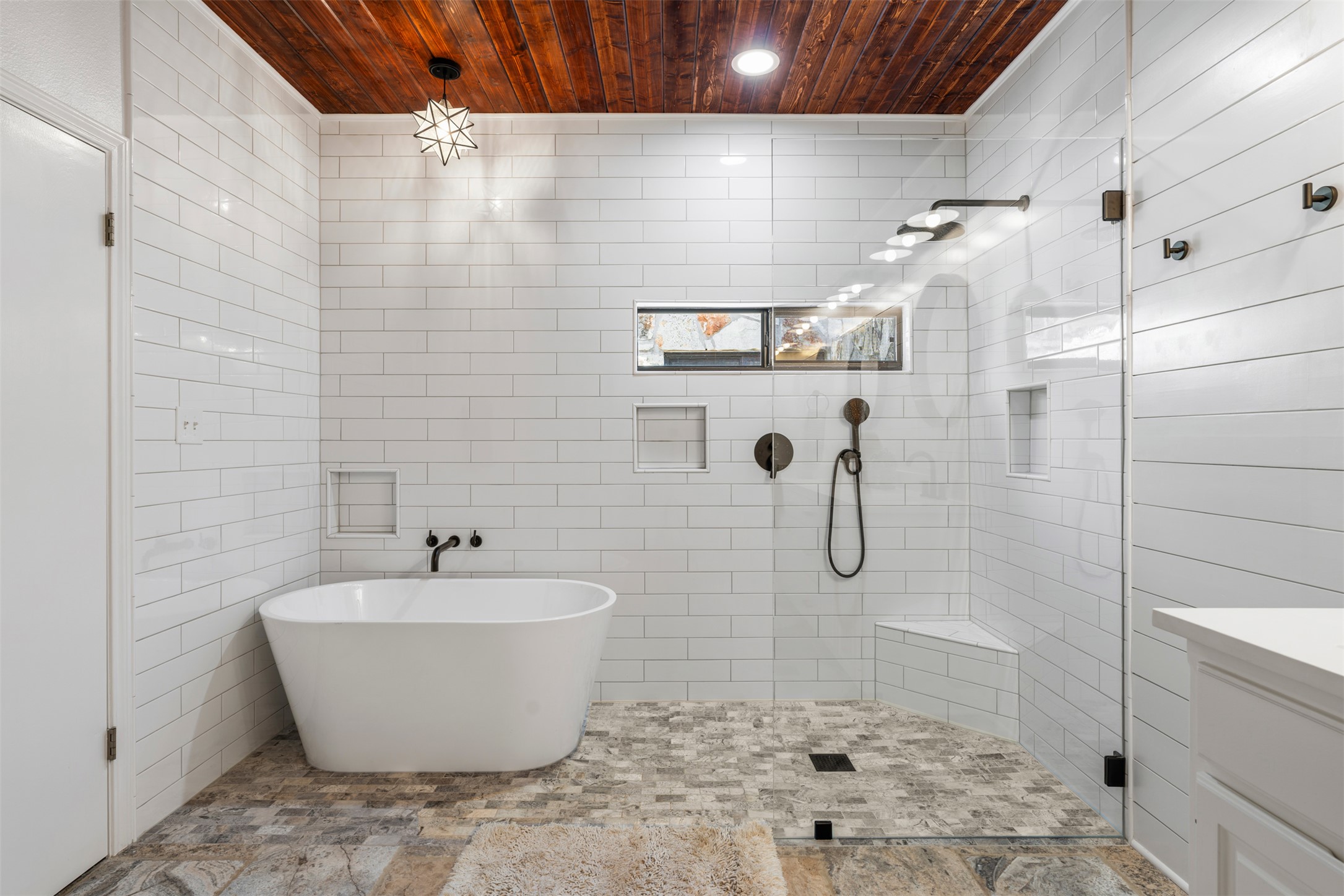 208 Amandas Way Leander, TX 78641 - Photo 11 of 25 Full bath with a walk in Shower & freestanding tub, vanity, and tile walls