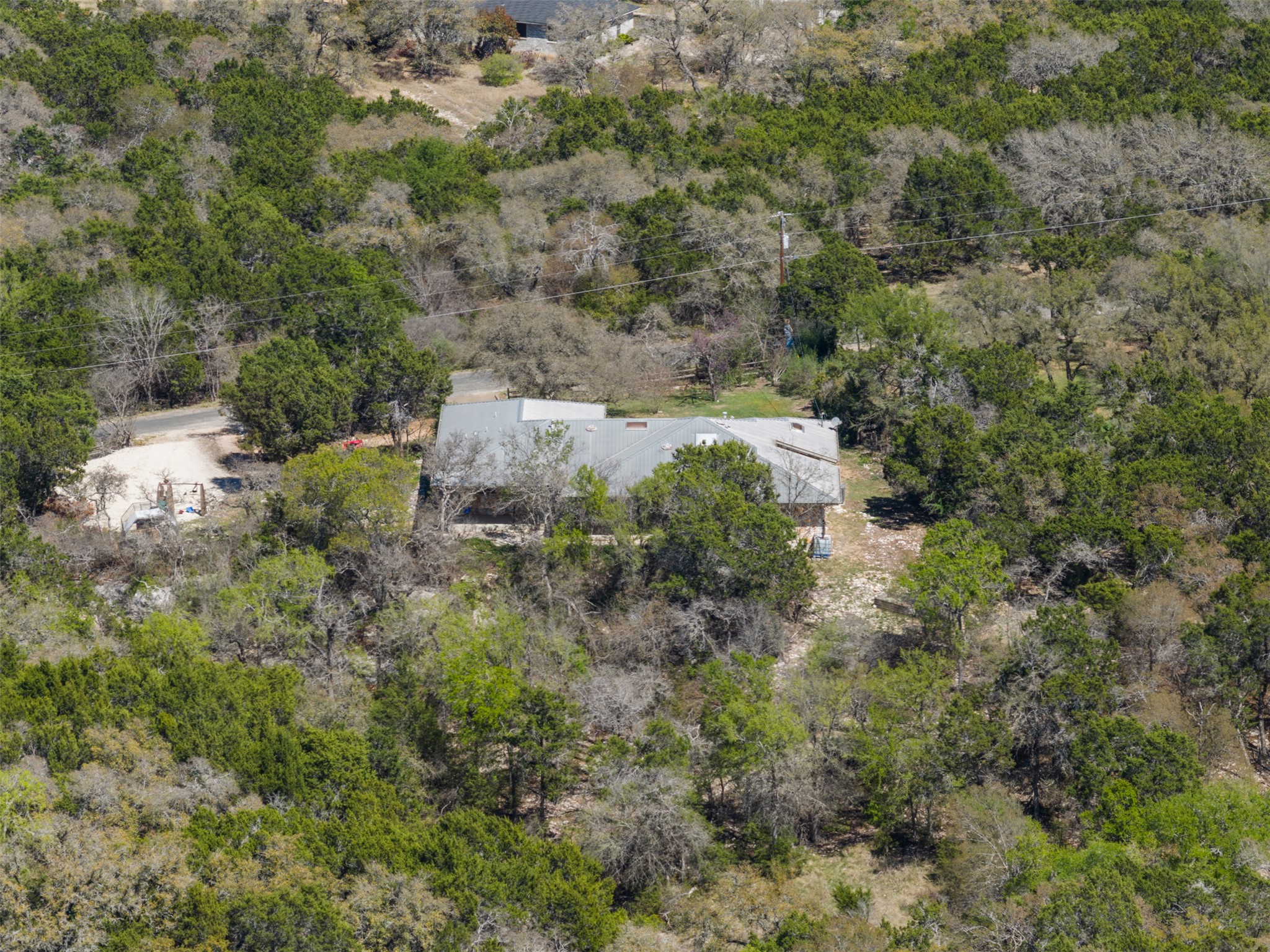 208 Amandas Way Leander, TX 78641 - Photo 22 of 25 Aerial view of property and surrounding area with a tree filled landscape