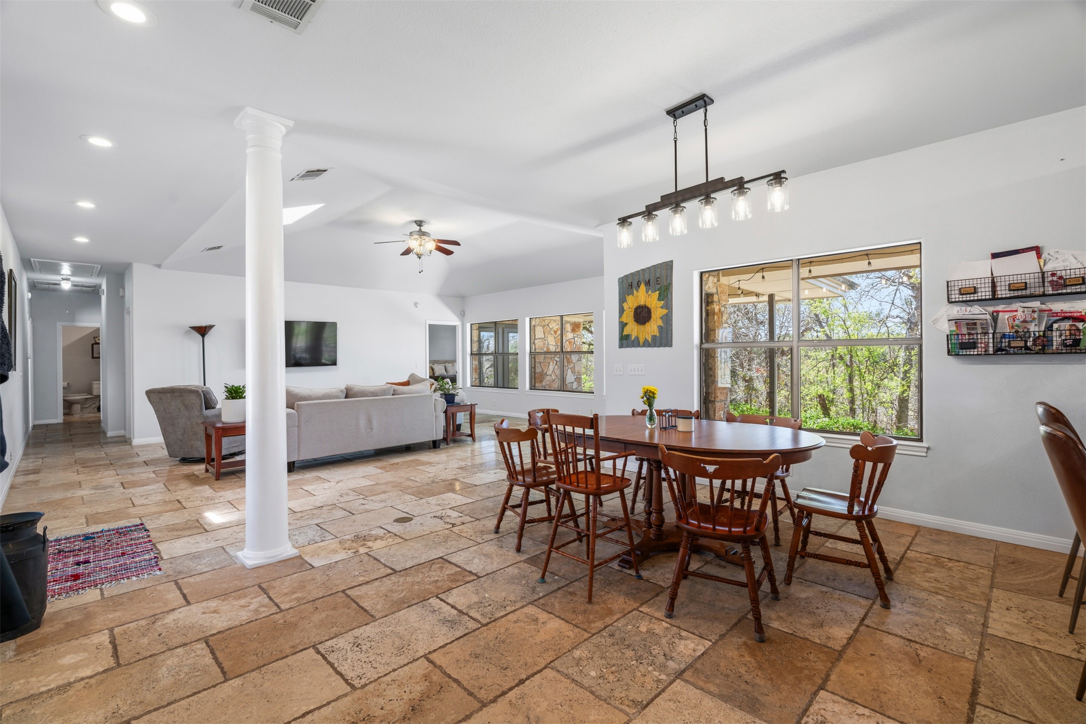 208 Amandas Way Leander, TX 78641 - Photo 3 of 25 Dining space with stone tile flooring, recessed lighting, decorative columns, and ceiling fan
