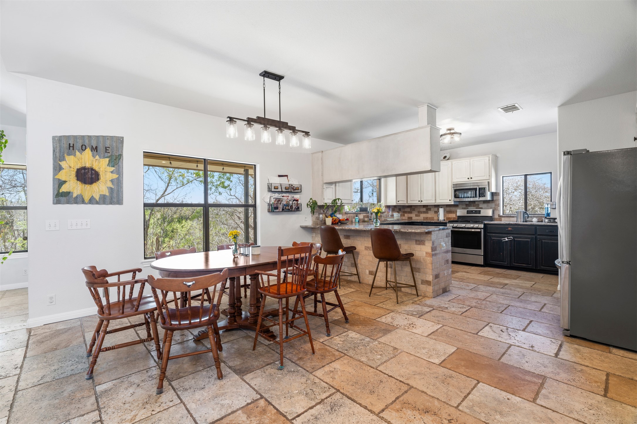 208 Amandas Way Leander, TX 78641 - Photo 4 of 25 Dining room with stone tile flooring and healthy amount of natural light